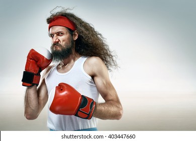 Funny boxer with red boxing gloves