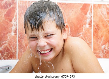 Funny Boy In Bath Under Cold Water Spurts Flushing From Shower