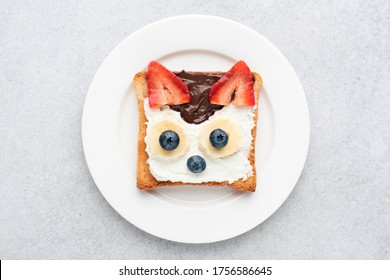 Funny Breakfast Toast For Kids Shaped As Cute Cat. Animal Food Art Sandwich For Kids. Isolated