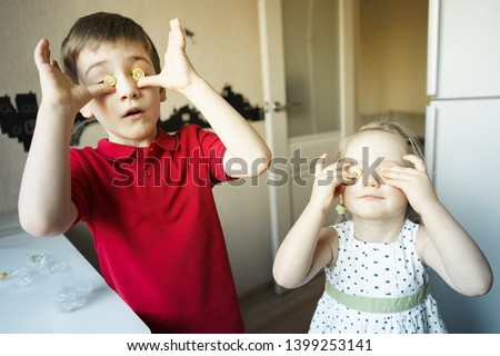 funny brother and sister close their eyes with candy like glasses