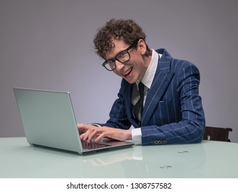 Funny Business Man Geek Using Laptop With Evil Genius Facial Expression