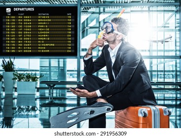 Funny business man ready for holidays wearing a scuba diving mask Travel concept