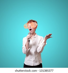 Funny Business Woman Singing With Big Orange Eyeglasses On Blue Background