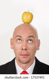 Funny Businessman Having Apple On His Head And Looking At It