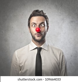 Funny Businessman With Red Plastic Nose