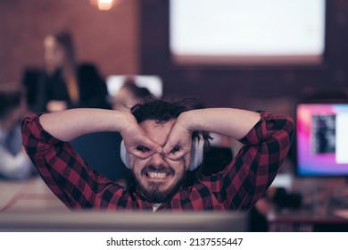 Funny Businessman Wearing Headset Having Virtual Team Meeting Group Call Chatting With Diverse People In Customer Support. Video Conference Call On Computer With Manager And Employees.