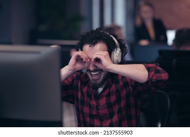 Funny Businessman Wearing Headset Having Virtual Team Meeting Group Call Chatting With Diverse People In Customer Support. Video Conference Call On Computer With Manager And Employees.