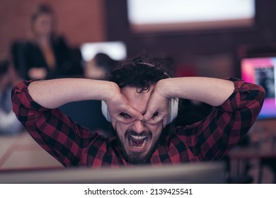 Funny Businessman Wearing Headset Having Virtual Team Meeting Group Call Chatting With Diverse People In Customer Support. Video Conference Call On Computer With Manager And Employees.