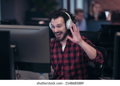 Funny Businessman Wearing Headset Having Virtual Team Meeting Group Call Chatting With Diverse People In Customer Support. Video Conference Call On Computer With Manager And Employees.