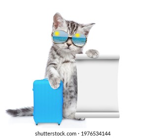 Funny Cat Wearing Mirrored Sunglasses Holds Suitcase An Shows Empty List. Isolated On White Background.