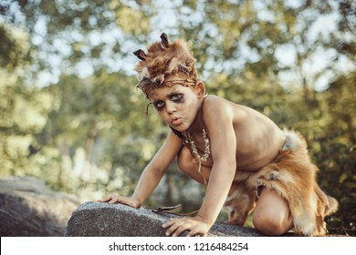 Funny Caveman, Manly Boy. Prehistoric Tribal Man Outdoors On Nature. Primitive Ice Age Man In Animal Skin. Reconstruction Of Neanderthal And Cro-magnon Life