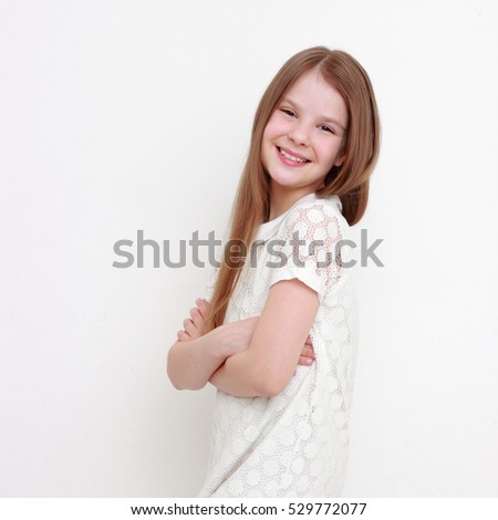 Funny and cheerful teen girl as a fashion model