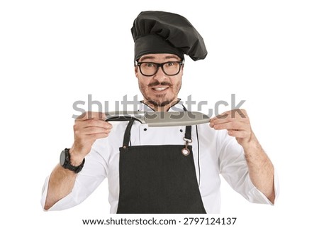 Funny chef holding a large kitchen knife with an expressive face isolated on a light background. Concept of cooking, restaurant work and culinary humor.