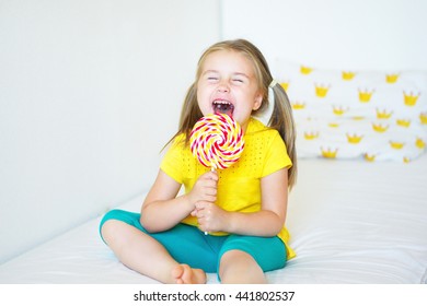 Funny Child With Candy Lollipop, Happy Little Girl Eating Big Sugar Lollipop, Kid Eat Sweets