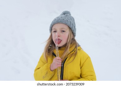 Funny Child, Cute Girl Playing In Winter Snowy Park. Christmas Holiday, Winter Weekend For Kids.