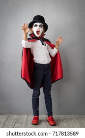 Funny Child Dressed Halloween Costume. Kid Painted Terrible Vampire. Autumn Holiday Concept