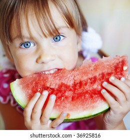 Funny Child Eating Watermelon Closeup