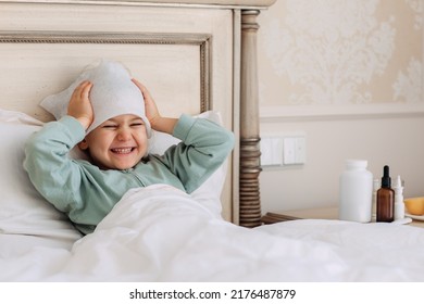 Funny Child Girl Laying Down Bed At Home, Sick Day, Feeling Bad Measures Temperature Taking Medicine. Virus Cold Season Illness