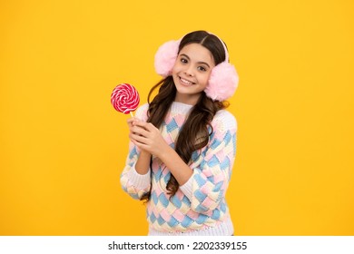 Funny Child With Lollipop Over Yellow Isolated Background. Sweet Childhood Life. Teen Girl With Yummy Caramel Lollipop, Candy Shop. Teenager With Sweet Sucker.