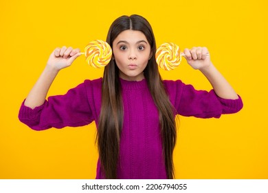 Funny Child With Lollipop Over Yellow Isolated Background. Sweet Childhood Life. Teen Girl With Yummy Caramel Lollipop, Candy Shop. Funny Face.