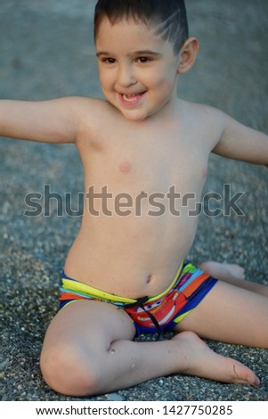 Similar – Cute little boy toaching the water with his feet.