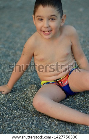 Similar – Cute little boy toaching the water with his feet.