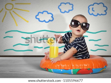 Funny child on swimming ring at home. Beach rest concept