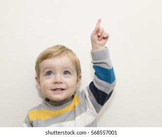 Funny Child Pointing Up On White Background