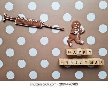 Funny Christmas Gingerbread Cookies. Coronavirus Pandemics. Honey Man Running From Big Chocolate Injection. Anti Vaccine Theme. Happy Christmas In Wooden Cubes. Ironic Greeting 