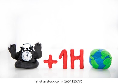 Funny Clocks Made From Play Clay. Isolated On White Background.  Daylight Saving Time Concept.