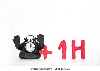 Funny Clocks Made From Play Clay. Isolated On White Background.  Daylight Saving Time Concept.