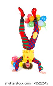 Funny Clown With Balloons In Headstand On White Background