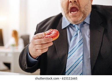 Funny Compulsive Guy Eating A Doughnut