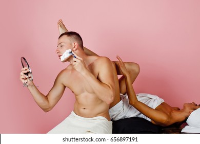 Funny Concept. Close Up Of Woman Shaving Legs In Bathroom. Close Up Of Legs Of Healthy Girl Shaving It Carefully. She Has Shaving Cream On Her Legs. Couple In Love. Love Story. Good Morning. Fashion