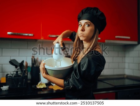 
Funny Cook Making Grimaces While Failing at Baking. Clueless clumsy housewife trying to make a dessert at home
