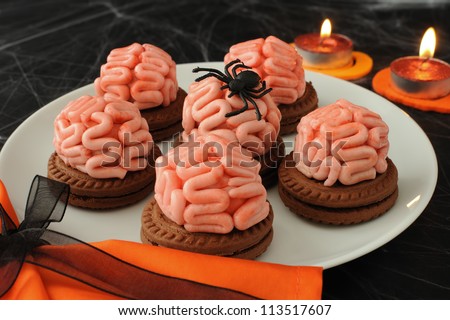 Funny cookie with brains of marzipan on Halloween