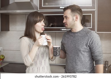 Funny Couple Joking In Kitchen