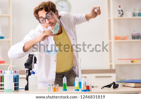 Funny crazy chemist doing experiments and tests