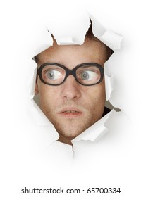 Funny Crazy Man Face In Old Eyeglasses Looking Out Of The Hole Isolated On White Background