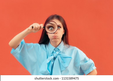 Funny Curious Girl Holding a Magnifying Glass. Critical woman looking trough a lens for clear observation
 - Shutterstock ID 1131589475