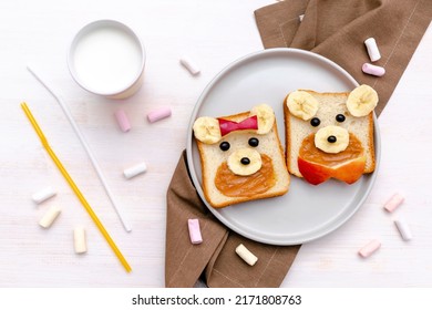 Funny Cute Bear,dog Faces Sandwich Toast Bread With Peanut Butter, Banana, Apple,milk, Marshmallow. Kids Childrens Baby's Sweet Dessert Healthy Breakfast Lunch Food Art On Plate,close Up,top View.