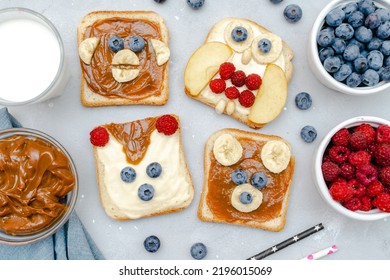 Funny Cute Bear,monkey,fox,owl Faces Sandwich Toast Bread With Peanut Butter,banana,blueberry,raspberry,milk. Kids Childrens Baby's Sweet Dessert Healthy Breakfast Lunch Food Art,close Up,top View