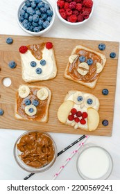 Funny Cute Bear,monkey,fox,owl Faces Sandwich Toast Bread With Peanut Butter,banana,blueberry,raspberry,milk. Kids Childrens Baby's Sweet Dessert Healthy Breakfast Lunch Food Art,close Up,top View