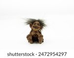 Funny cute troll toy. Troll figurine on white background