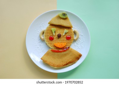 Funny Dessert In Shape Of Clown. Food Art. Pancakes And Waffle For Breakfast. Lunch  For Kids. Tea Time. Restaurant Menu.                   