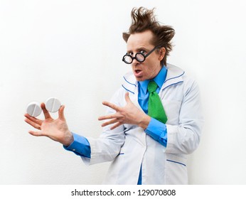 Funny doctor with tablet in hand