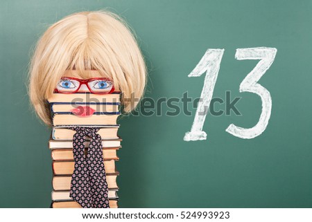 Funny education idea, woman teacher in front of blackboard with title 13
