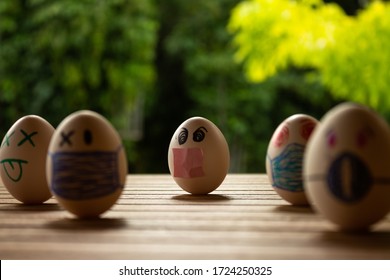 Funny Eggs With Human Faces. Eggs Wearing Face Masks Or Chinstraps. Selective Focus. Colored Chinstraps On White Eggs.