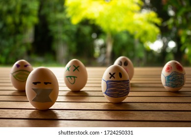 Funny Eggs With Human Faces. Eggs Wearing Face Masks Or Chinstraps. Selective Focus. Colored Chinstraps On White Eggs.