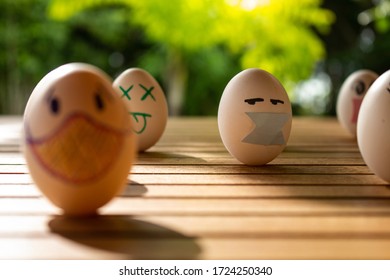 Funny Eggs With Human Faces. Eggs Wearing Face Masks Or Chinstraps. Selective Focus. Colored Chinstraps On White Eggs.